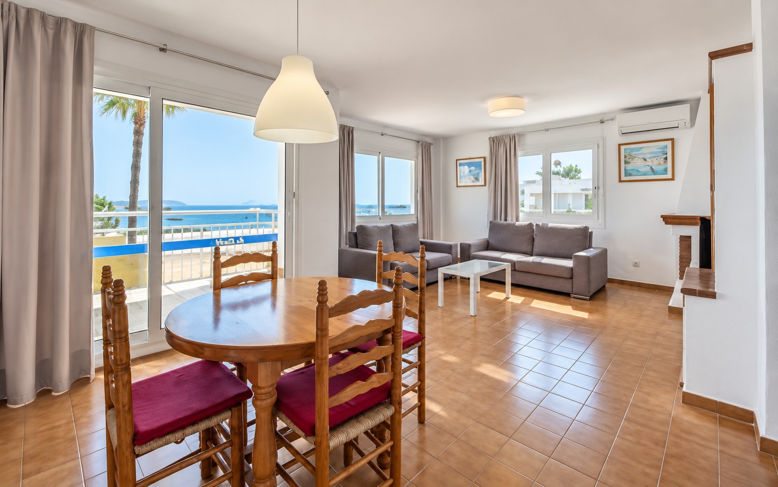 Spacious three-bedroom apartment living and dining room with bay views